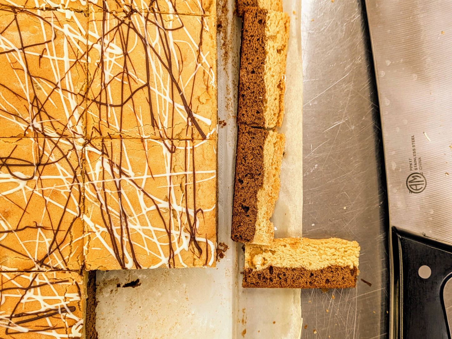 Large Coffee White Chocolate Brookie cut with knife