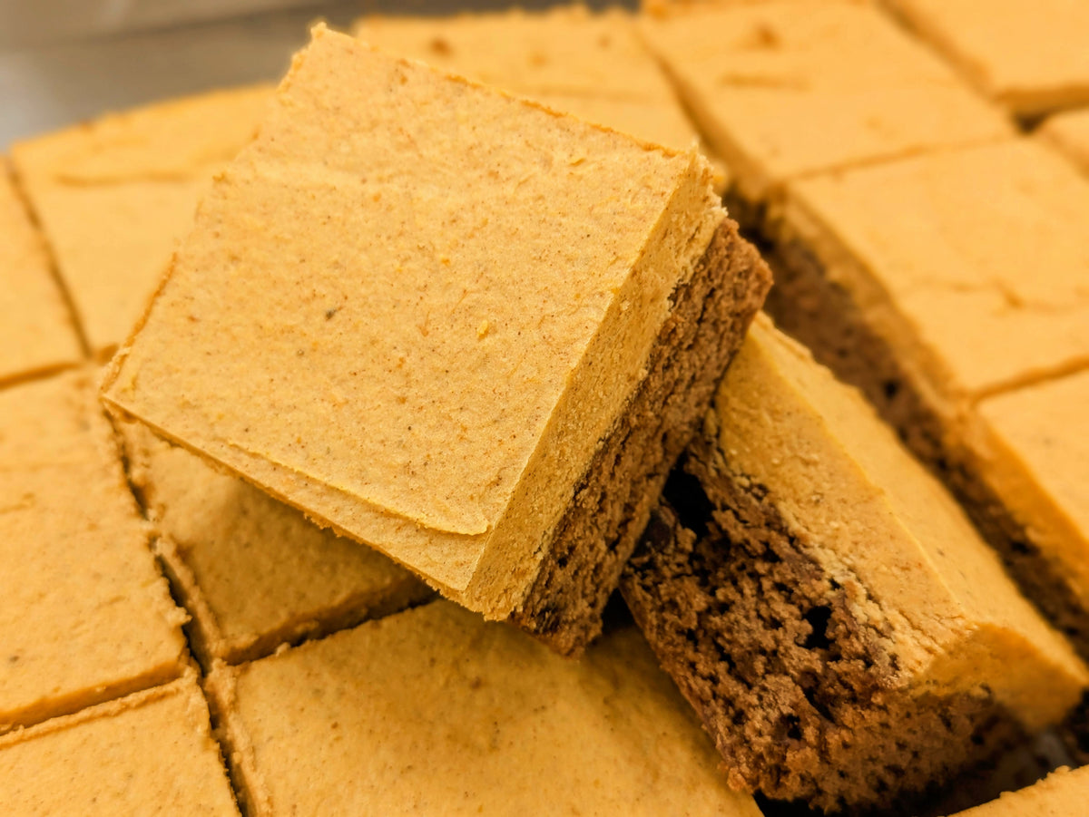 Pumpkin Spice Cream on top of a fudgy chocolate bottom layer stacked on other brownies