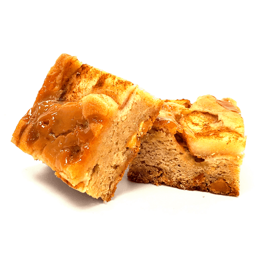 Two Buckabee Brownies Caramel Apple Blondies showing golden cinnamon base with caramel-coated apple pieces on top
