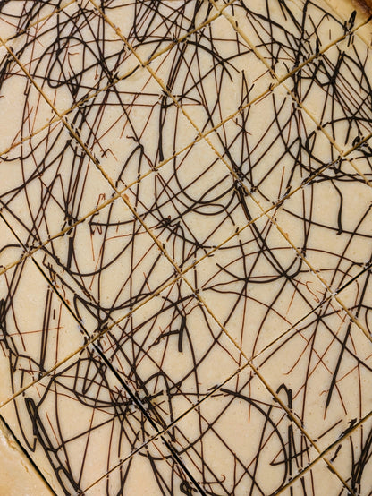 Irish Cream Cheese Brownie cut in pan for St. Patrick's Day