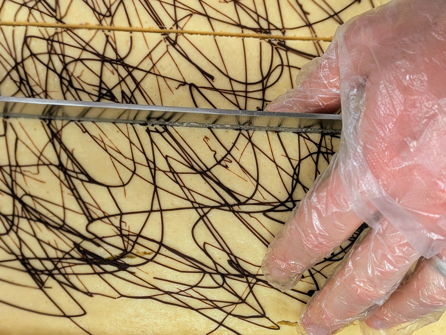 Irish Cream Cheese Brownie cutting for St. Patrick's Day