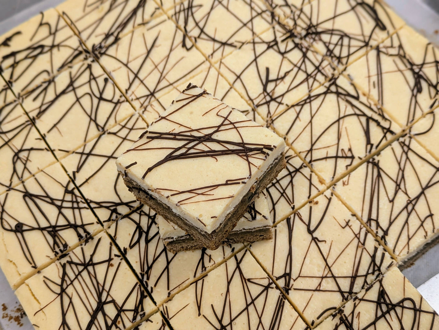 Irish Cream Cheese Brownie stacked in pan for St. Patrick's Day