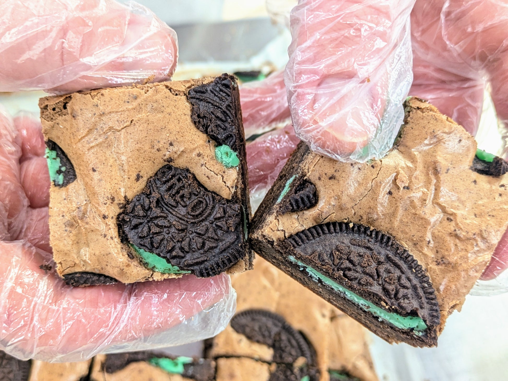 Mint Cookies & Cream Brownie in hand for St. Patrick's Day