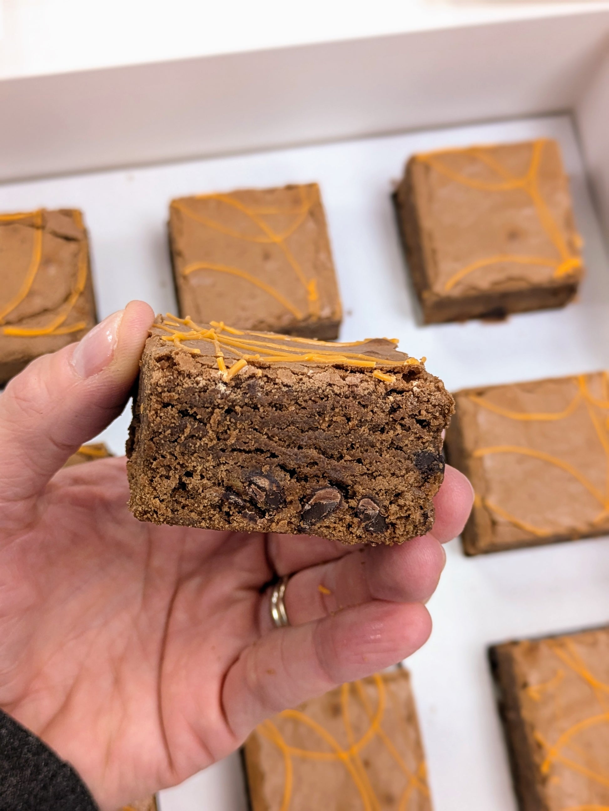 Orange Fudgy Chocolate Brownie close up and box