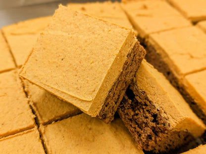 Pumpkin Spice Cream on top of a fudgy chocolate bottom layer stacked on other brownies