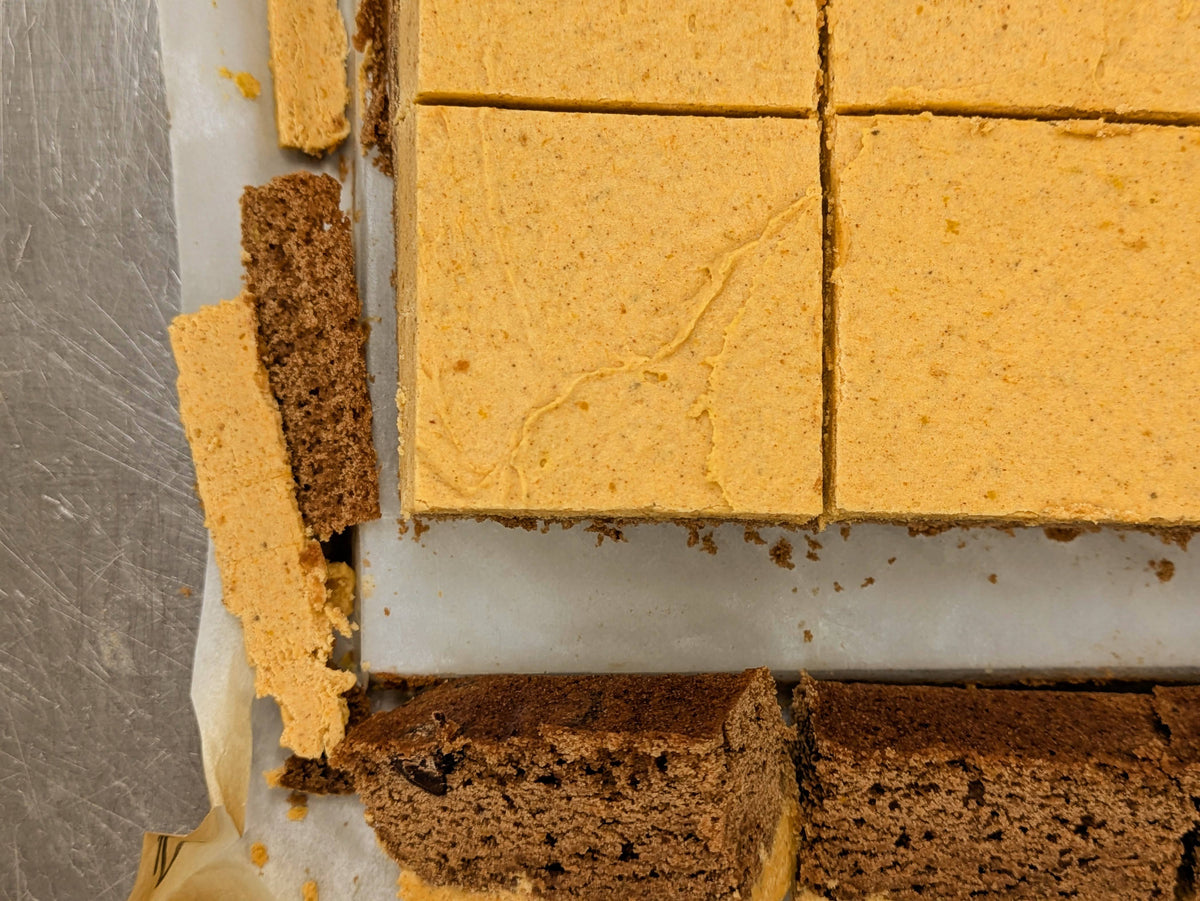 Pumpkin spice cream brownies and pieces of fudgy chocolate brownie edges