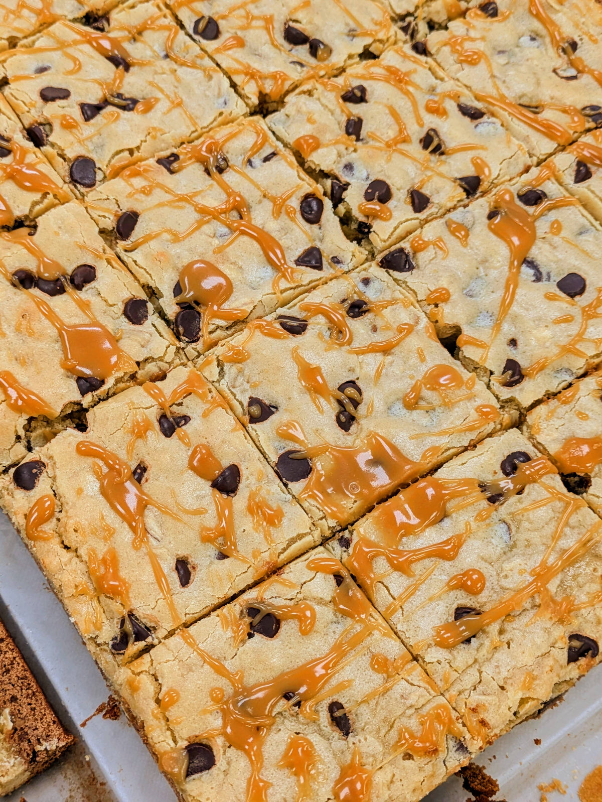 Buckabee Salted Caramel Oatmeal Brookies cut into squares with golden caramel drizzle.