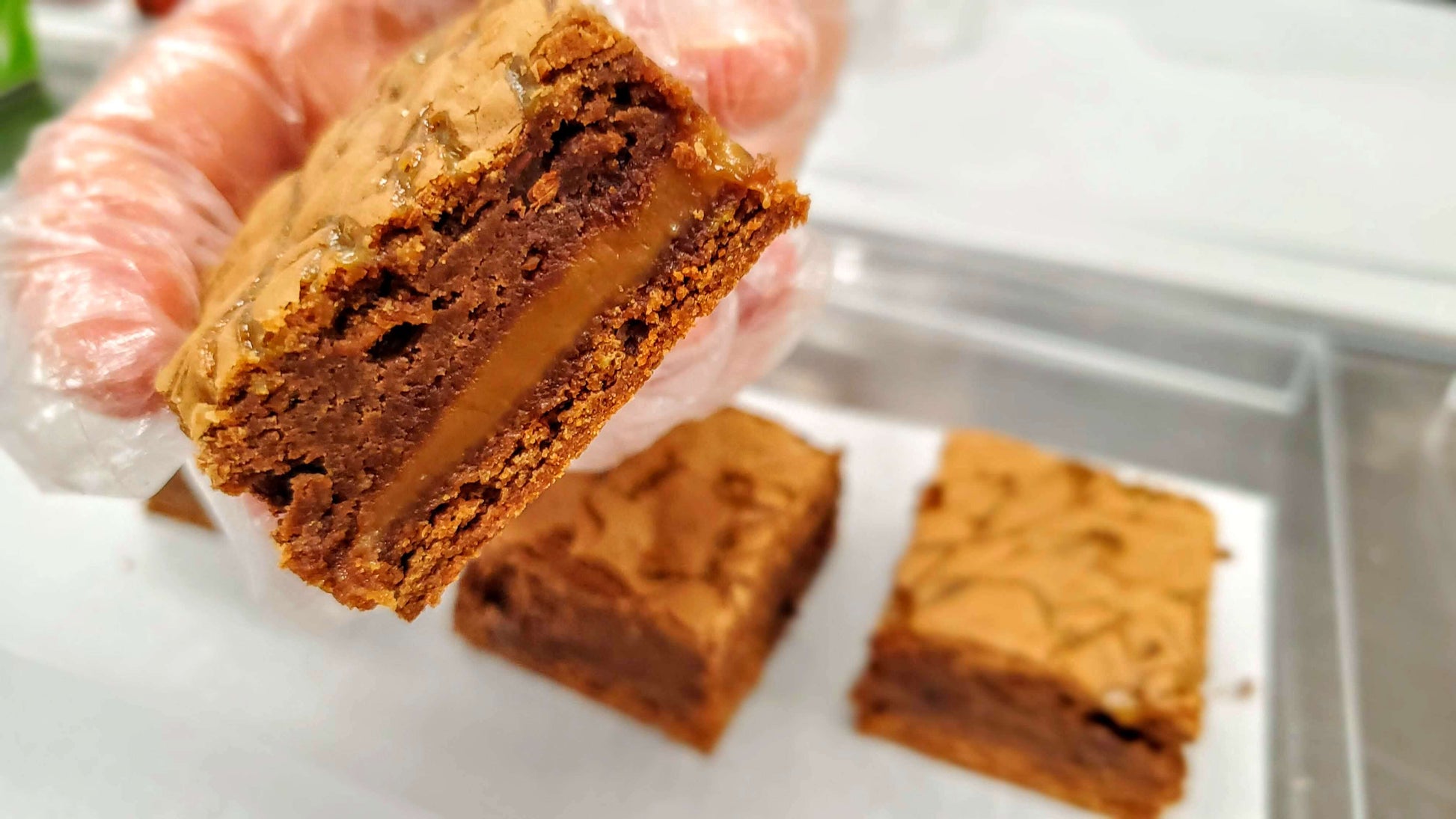 Salted Caramel Brownie close up in hand