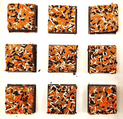 Nine Who Dey brownies with sprinkles arranged in a 3x3 grid on a white background. 
